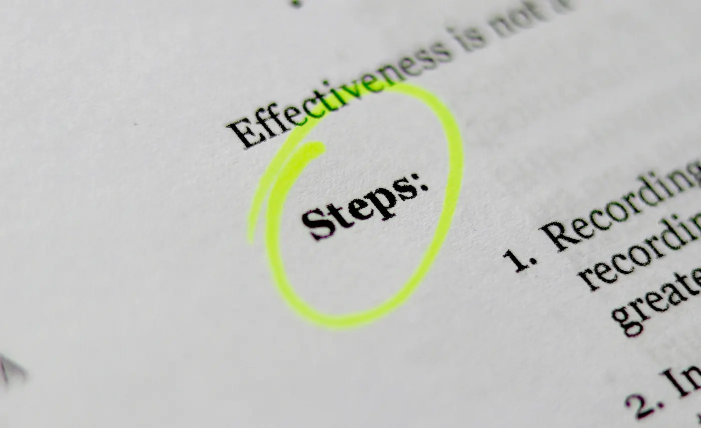 Printed page with the word Steps circled in green highlighter